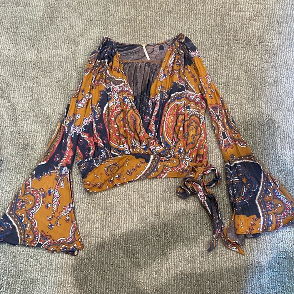 Free People top size M bell sleeves, side tie, deep V
